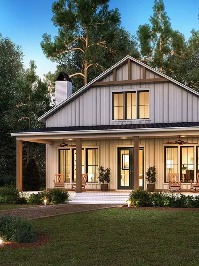 Open-plan barndominium interior with vaulted ceiling and exposed timber trusses