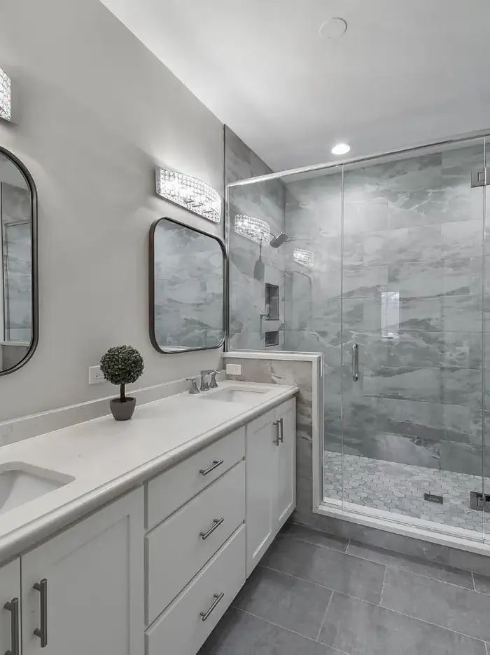 Marble and Movement Master and Powder Bath Remodel — completed powder room remodel by Bulldog Remodel Group